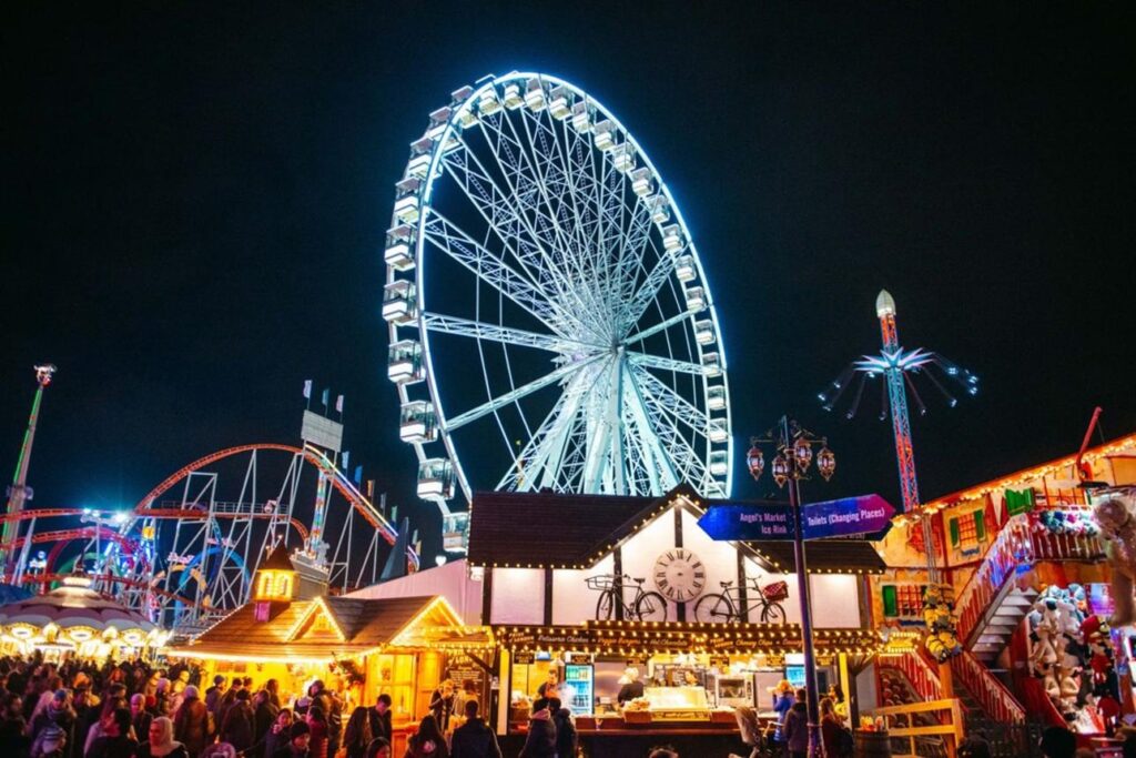 Hyde Park Winter Wonderland: Giant Ferris wheel and illuminated fairground attractions at Hyde Park Winter Wonderland in London.